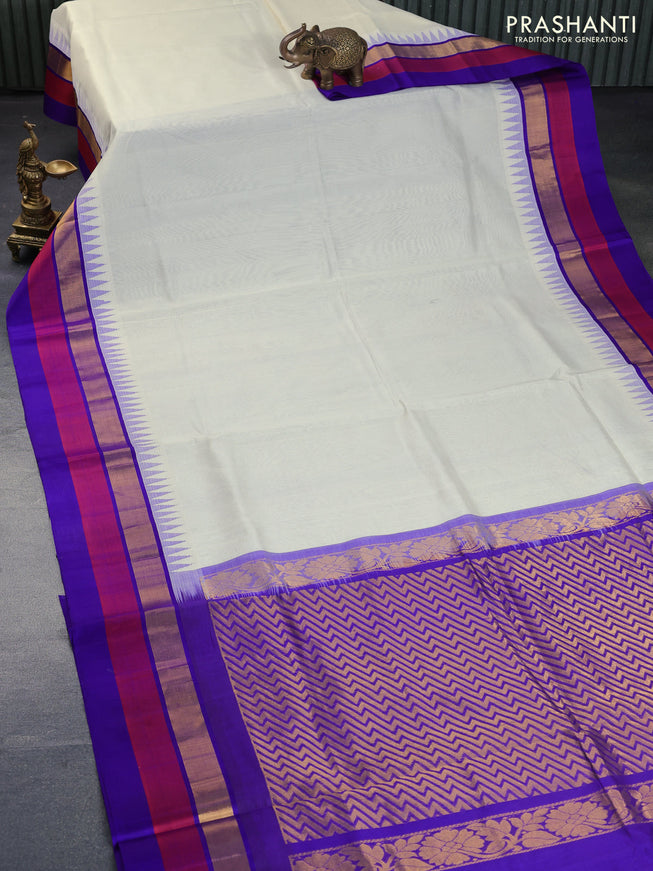 Kuppadam silk cotton saree off white and blue with plain body and temple design zari woven border