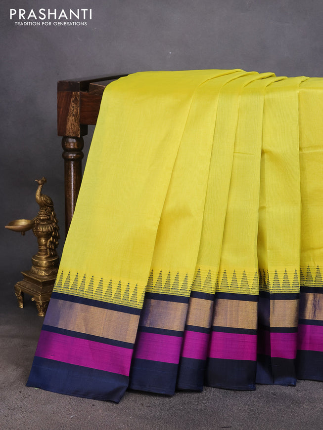 Kuppadam silk cotton saree lime yellow and dark peacock blur with plain body and temple design zari woven border