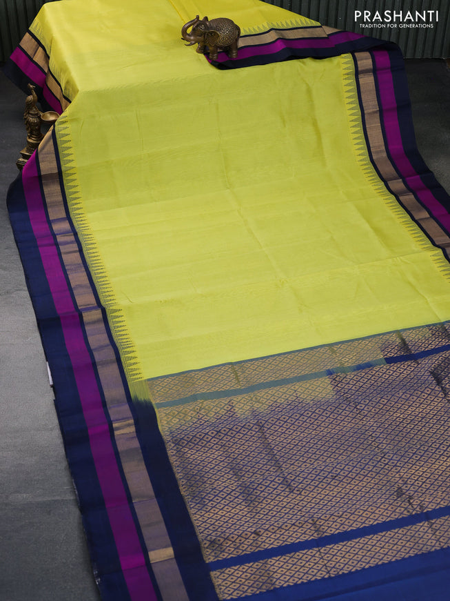 Kuppadam silk cotton saree lime yellow and dark peacock blur with plain body and temple design zari woven border