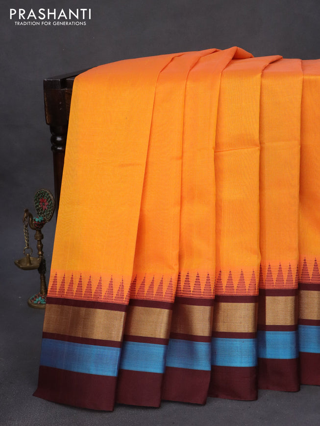 Kuppadam silk cotton saree orange and brown with plain body and temple design zari woven border