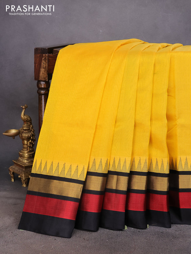 Kuppadam silk cotton saree yellow and black with plain body and temple design zari woven border