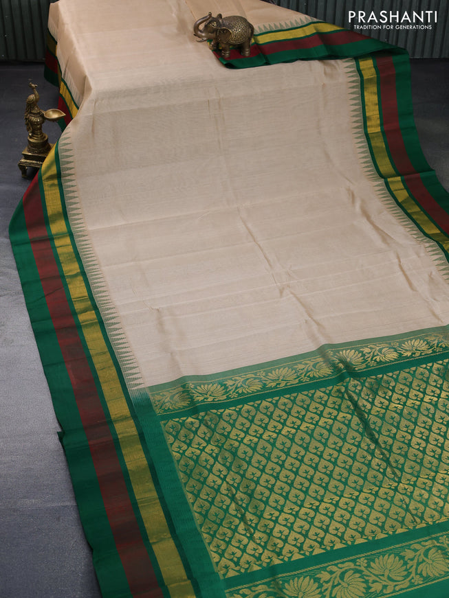 Kuppadam silk cotton saree beige and green with plain body and temple design zari woven border