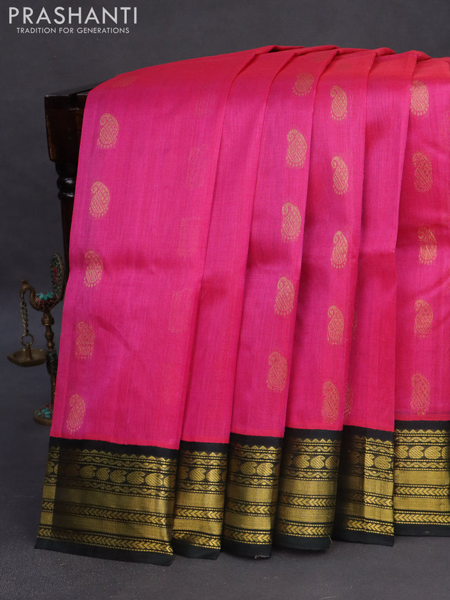 Kuppadam silk cotton saree pink and bottle green with allover zari woven paisley buttas and zari woven border