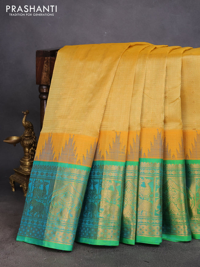 Kuppadam silk cotton saree yellow shade and dual shade of teal green with zari woven checks & buttas and long zari woven border