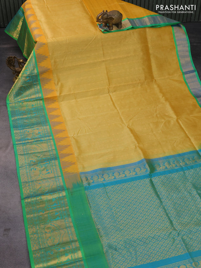 Kuppadam silk cotton saree yellow shade and dual shade of teal green with zari woven checks & buttas and long zari woven border