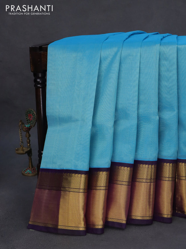 Kuppadam silk cotton saree light blue and deep violet with plain body and zari woven border