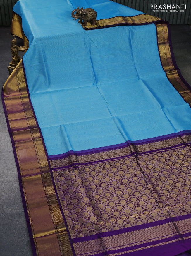 Kuppadam silk cotton saree light blue and deep violet with plain body and zari woven border