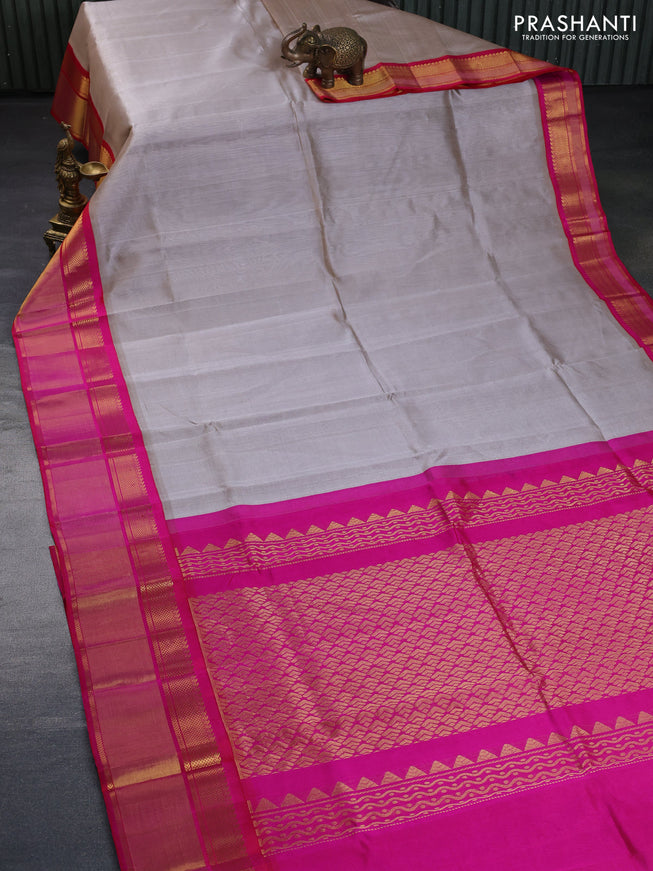 Kuppadam silk cotton saree pastel grey and pink with plain body and zari woven border