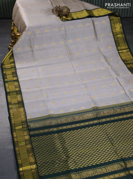 Kuppadam silk cotton saree grey and bottle green with allover zari woven buttas and zari woven border