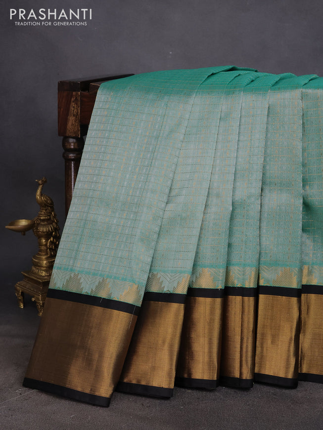 Kuppadam silk cotton saree teal green shade and black with zari woven checks & buttas and long temple design zari woven border