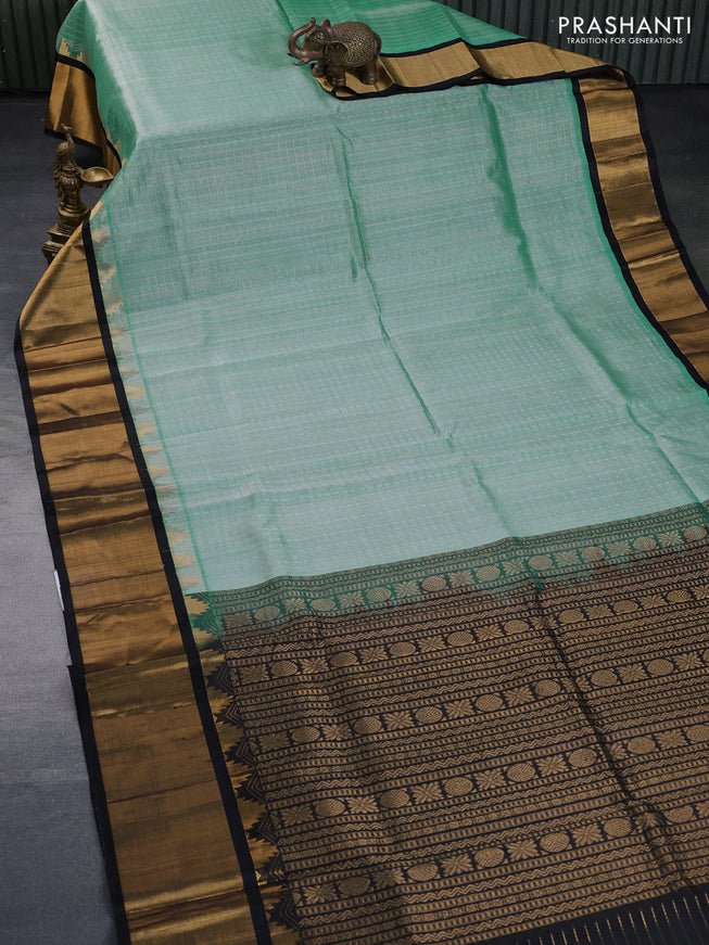 Kuppadam silk cotton saree teal green shade and black with zari woven checks & buttas and long temple design zari woven border