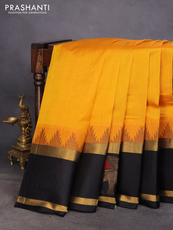 Kuppadam silk cotton saree mango yellow and black with plain body and temple design rettapet zari woven elephant butta border