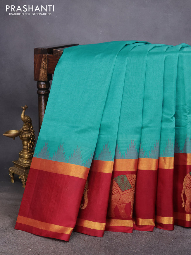 Kuppadam silk cotton saree teal blue and maroon with plain body and temple design rettapet zari woven elephant butta border