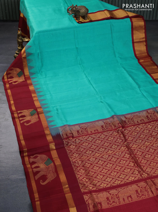 Kuppadam silk cotton saree teal blue and maroon with plain body and temple design rettapet zari woven elephant butta border