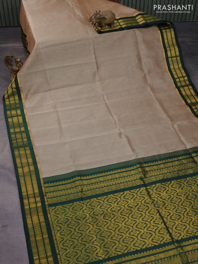 Kuppadam silk cotton saree dark beige and dark greem with allover zari woven buttas and zari woven border