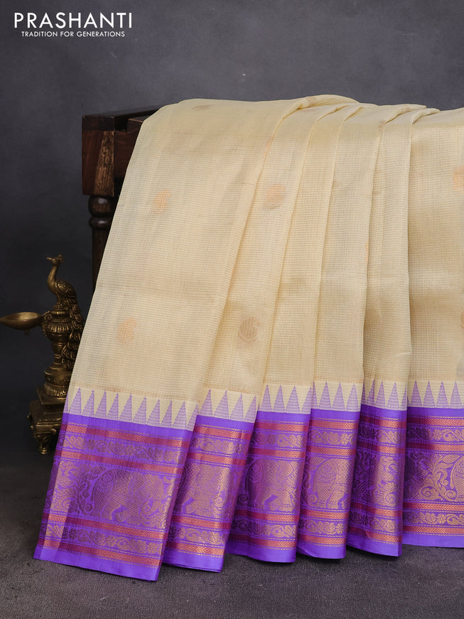 Kuppadam silk cotton saree cream and lavender with zari woven checks & buttas and temple design zari woven border