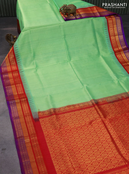 Kuppadam silk cotton saree teal shade shade and red with plain body and long zari woven border