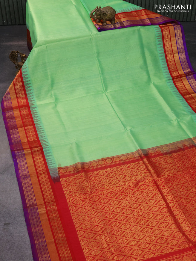 Kuppadam silk cotton saree teal shade shade and red with plain body and long zari woven border