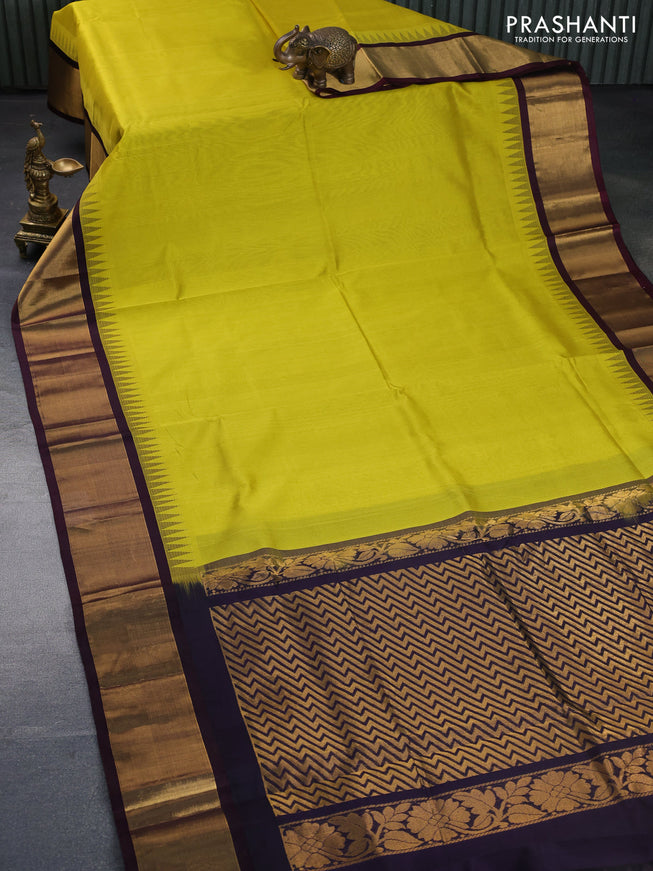 Kuppadam silk cotton saree lime yellow and deep jamun shade with plain body and zari woven border