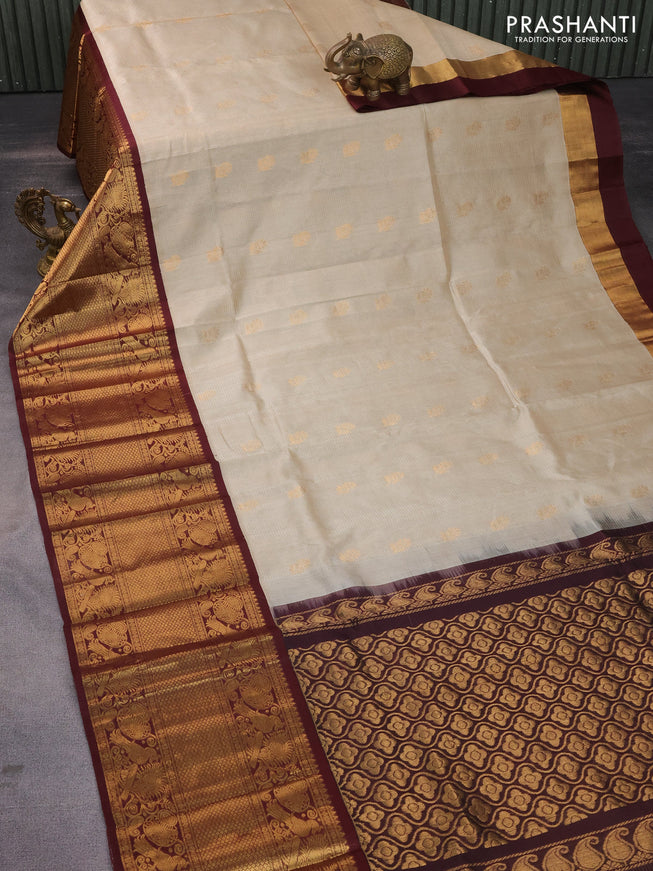 Kuppadam silk cotton saree beige and deep coffee brown with zari woven checks & buttas and long zari woven border