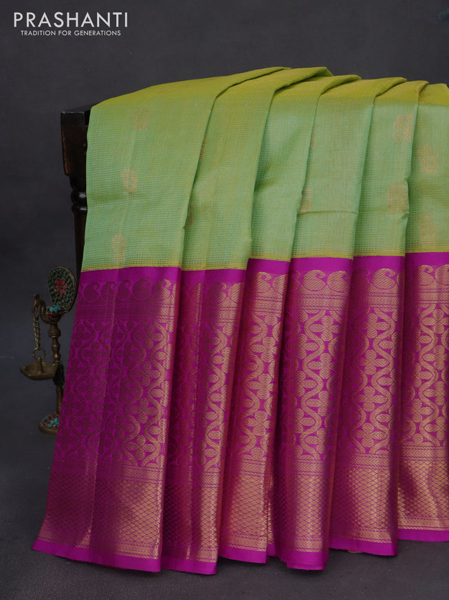 Kuppadam silk cotton saree dual shade of green and purple with zari woven checks & buttas and long zari woven border