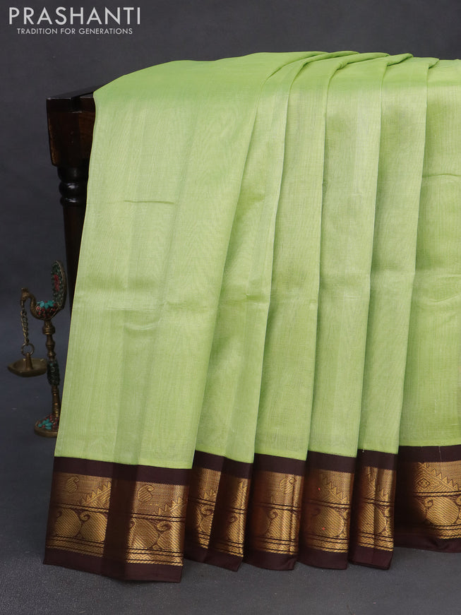 Silk cotton saree pista green and deep coffee brown with plain body and zari woven korvai border