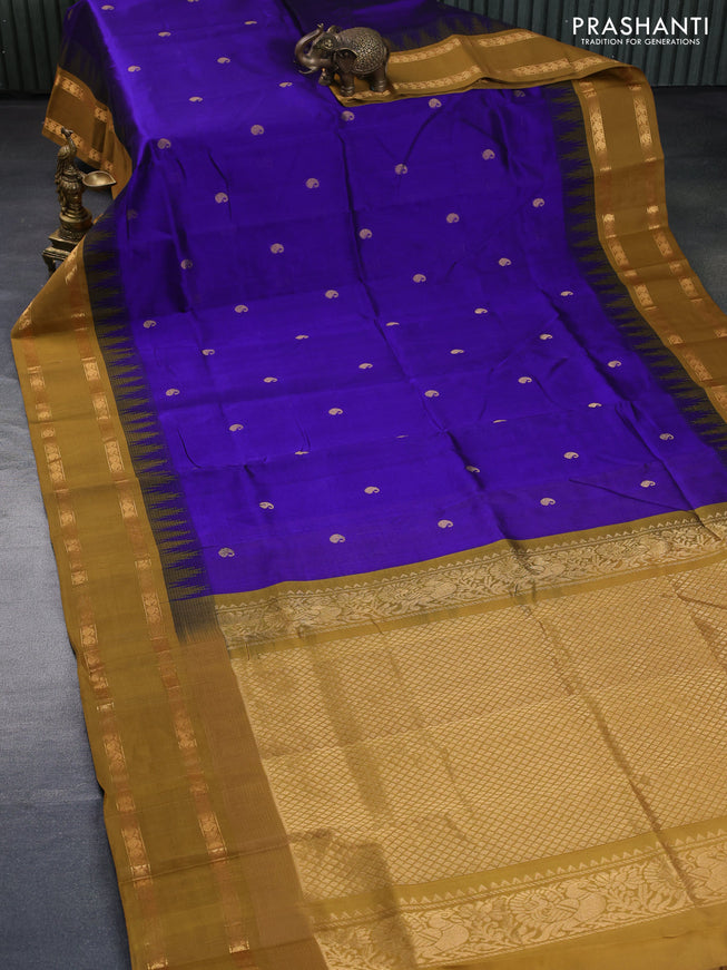 Silk cotton saree blue and dark mustard with zari woven paisley buttas and temple design rettapet zari woven korvai border