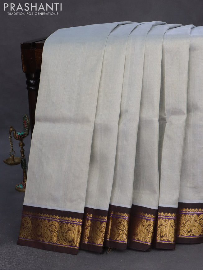 Silk cotton saree grey and coffee brown with plain body and zari woven korvai border