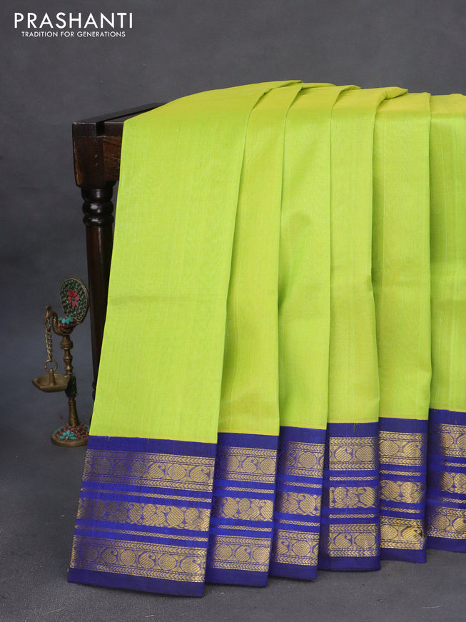 Silk cotton saree fluorescent green and blue with plain body and zari woven korvai border