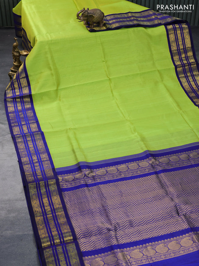 Silk cotton saree fluorescent green and blue with plain body and zari woven korvai border