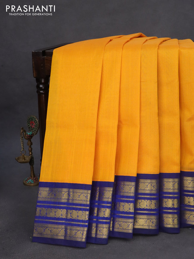 Silk cotton saree mango yellow and blue with plain body and zari woven korvai border