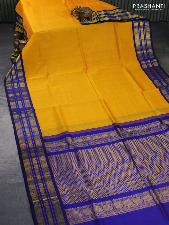 Silk cotton saree mango yellow and blue with plain body and zari woven korvai border