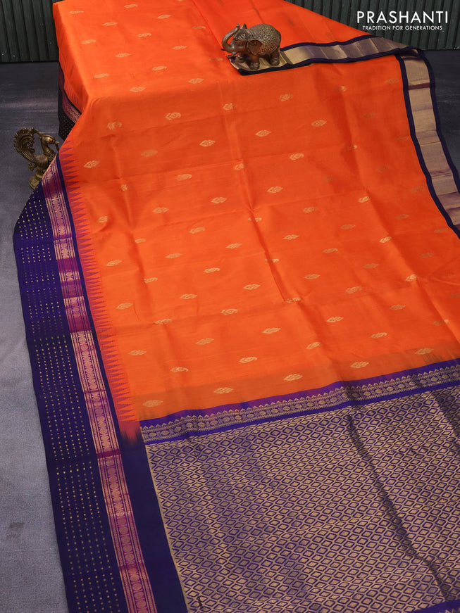 Silk cotton saree orange and navy blue with zari woven buttas and teample design zari woven korvai border