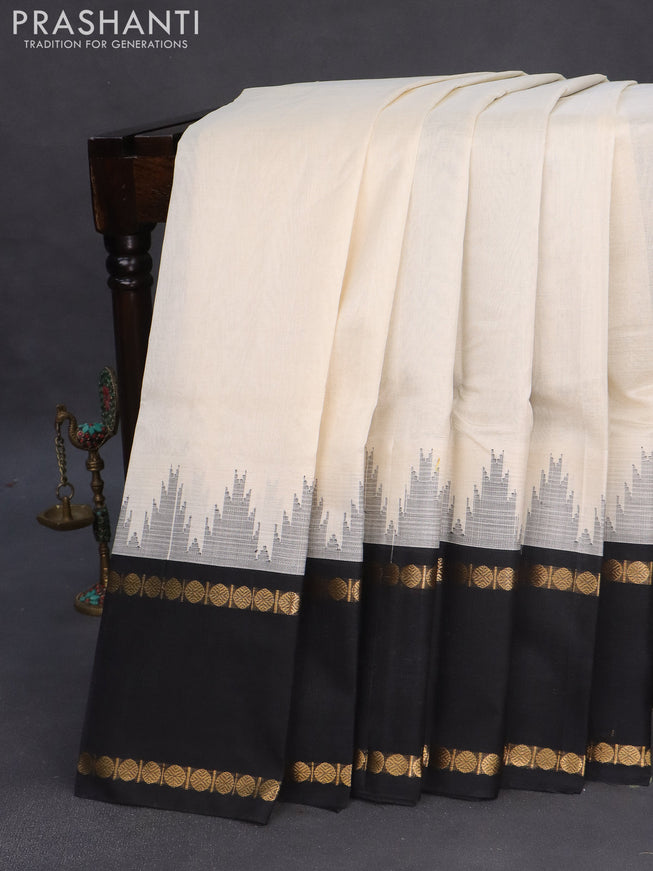 Silk cotton saree off white and black with plain body and temple design rettapet zari woven korvai border