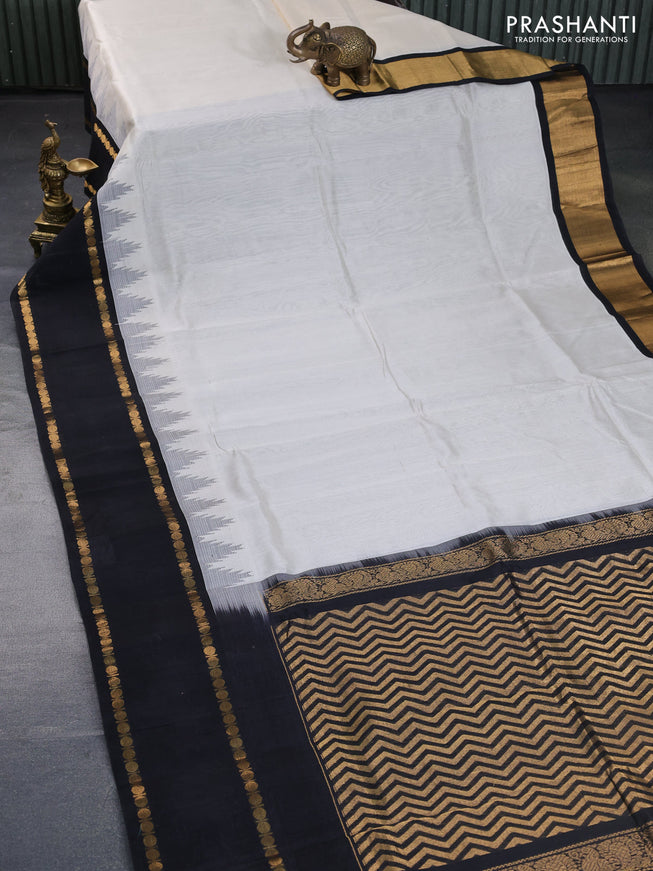 Silk cotton saree off white and black with plain body and temple design rettapet zari woven korvai border