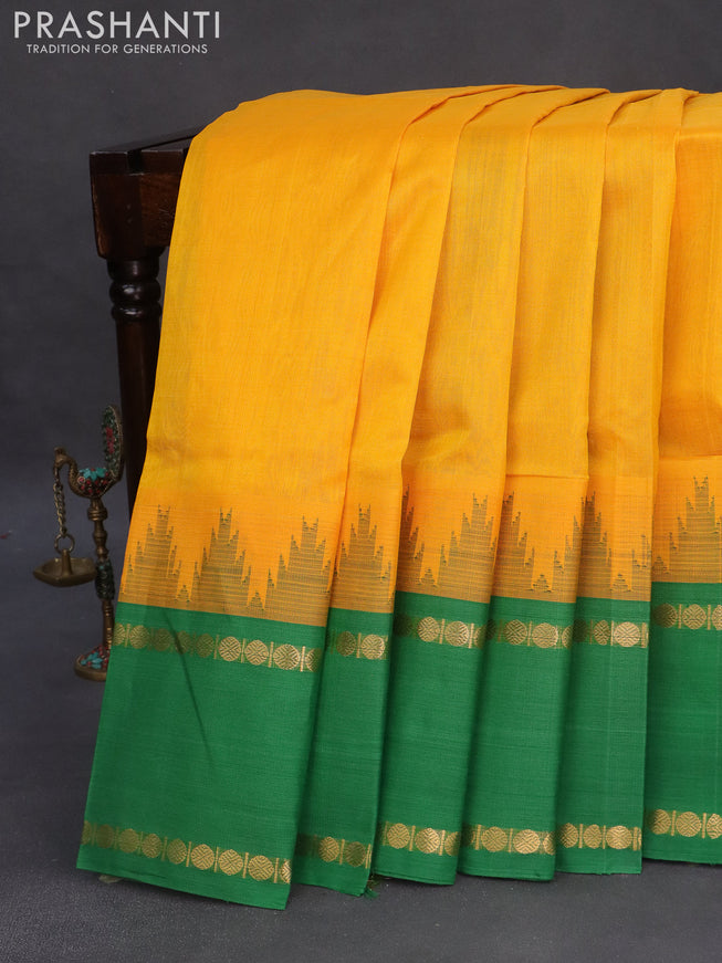 Silk cotton saree mango yellow and green with plain body and temple design rettapet zari woven korvai border