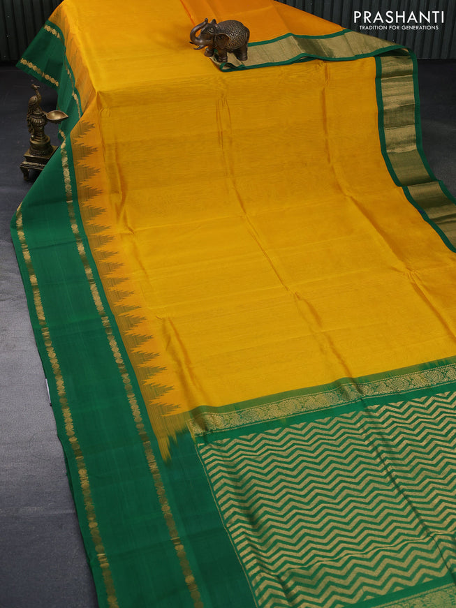 Silk cotton saree mango yellow and green with plain body and temple design rettapet zari woven korvai border