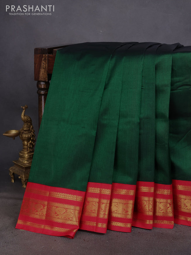 Silk cotton saree dark green and red with plain body and zari woven korvai annam border