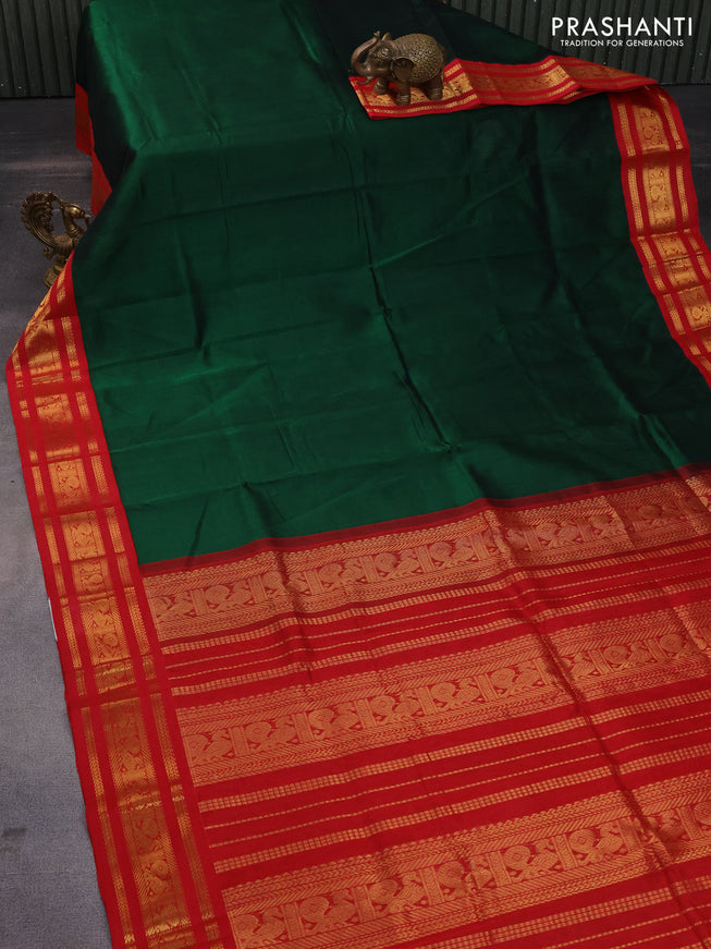 Silk cotton saree dark green and red with plain body and zari woven korvai annam border