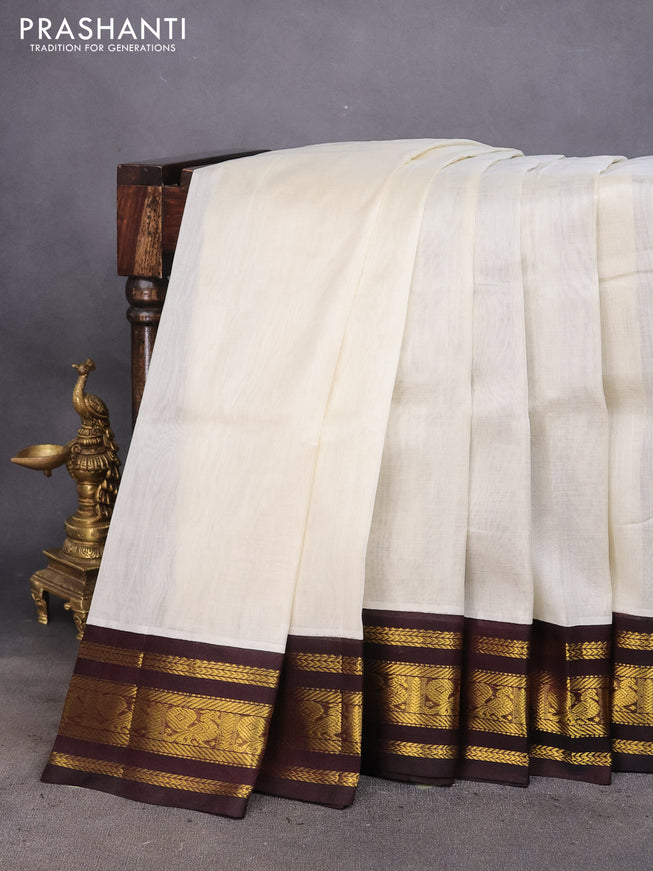 Silk cotton saree cream and deep coffee brown with plain body and zari woven korvai annam border