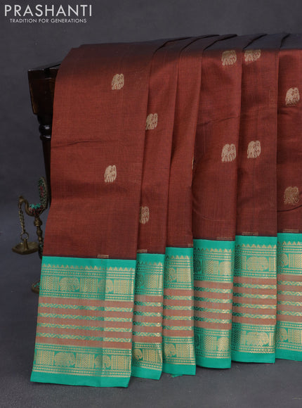 Silk cotton saree brown and teal blue with zari woven elephant buttas and long zari woven korvai border