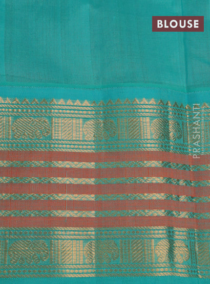 Silk cotton saree brown and teal blue with zari woven elephant buttas and long zari woven korvai border