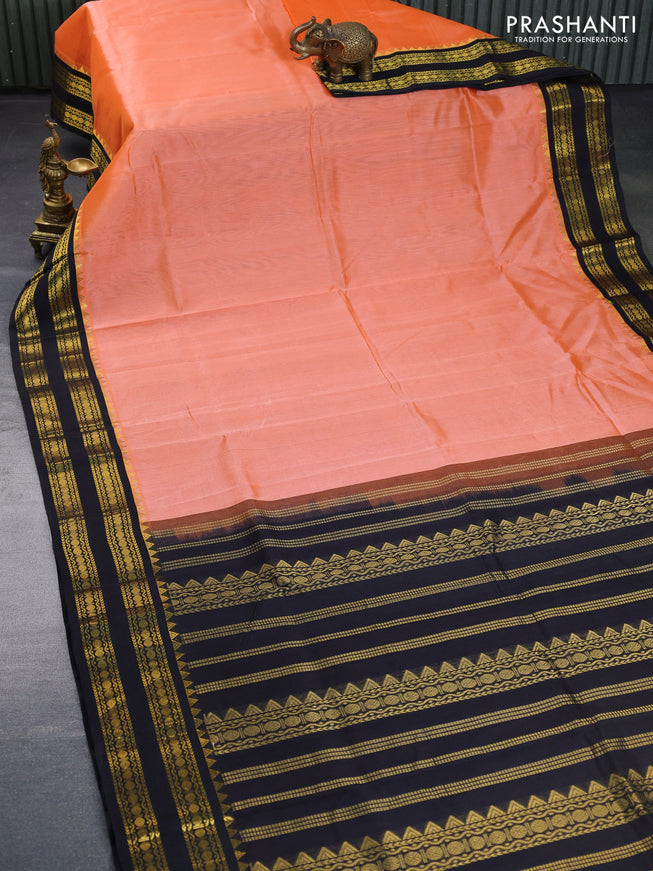 Silk cotton saree peach orange  and black with plain body and zari woven korvai border