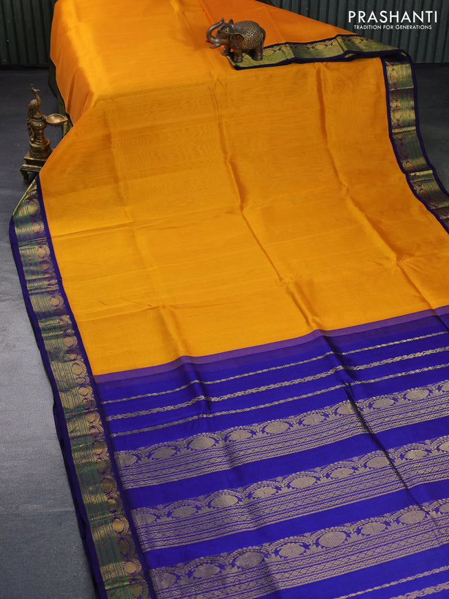 Silk cotton saree mango yellow and blue with plain body and zari woven korvai border