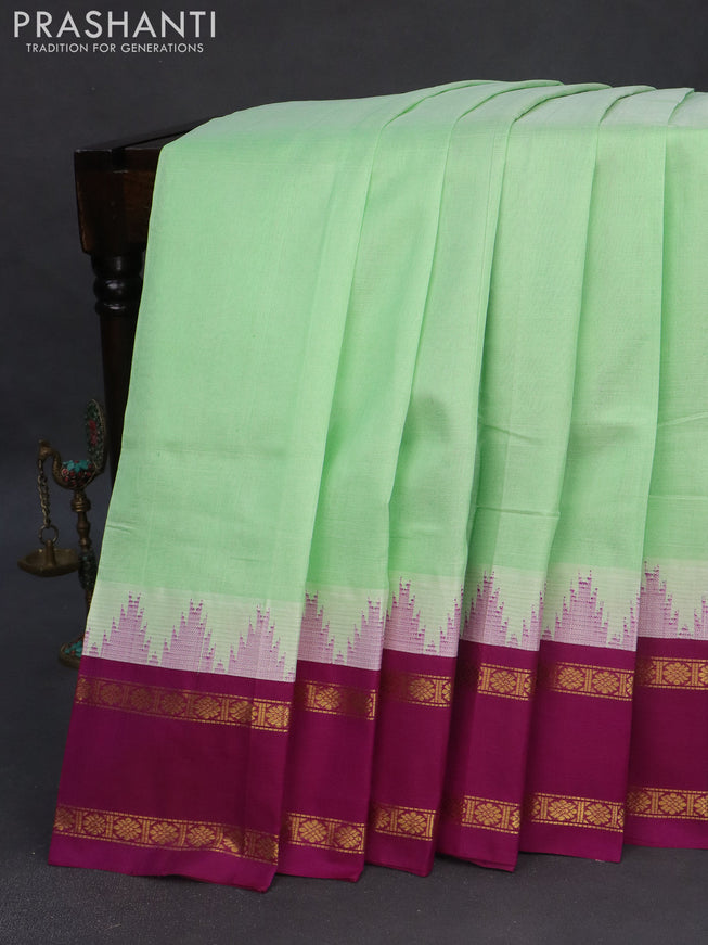 Silk cotton saree teal green shade and purple with plain body and temple design rettapet zari woven korvai border