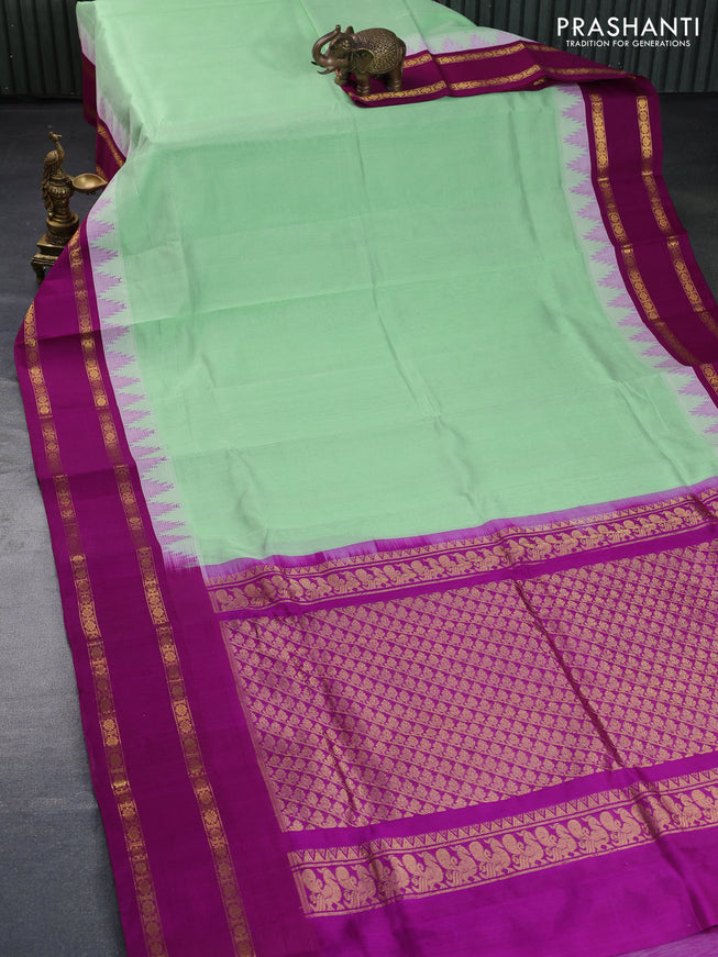 Silk cotton saree teal green shade and purple with plain body and temple design rettapet zari woven korvai border