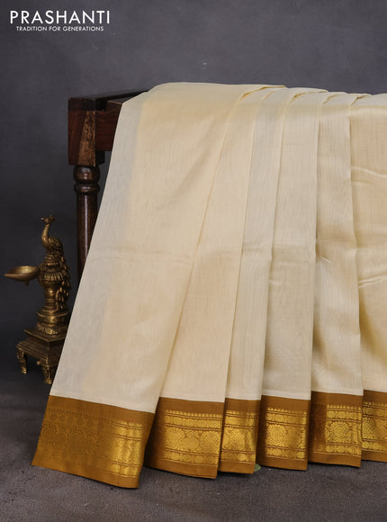 Silk cotton saree cream and mustard shade with plain body and zari woven annam korvai border