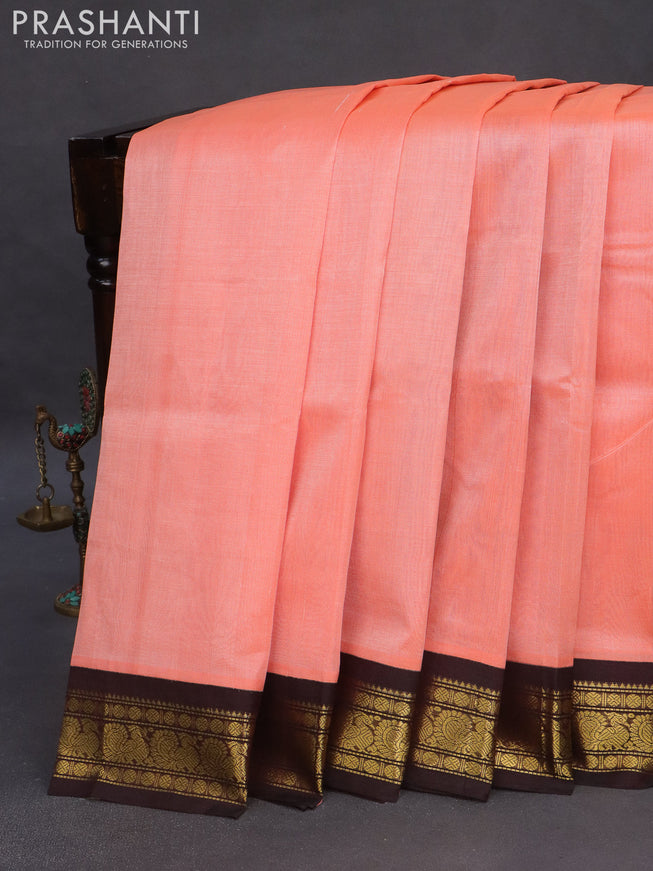 Silk cotton saree peach shade and coffee brown with plain body and zari woven annam korvai border