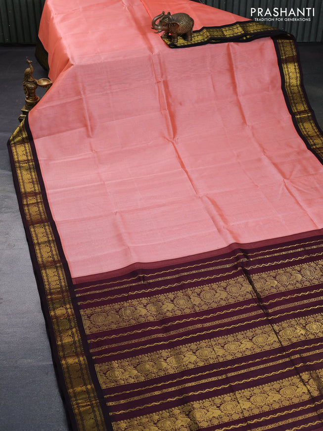 Silk cotton saree peach shade and coffee brown with plain body and zari woven annam korvai border