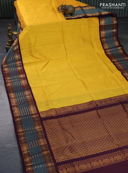 Silk cotton saree mango yellow and wine shade with zari woven elephant buttas and long zari woven korvai border